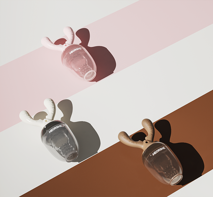Three silicone baby teethers and mesh feeders on a light surface with a neutral background