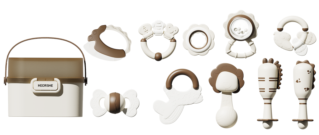 Collection of baby teething toys rattles and teethers and a storage container on a white background