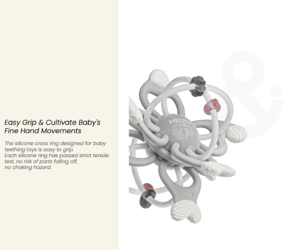 Silicone cross ring toy for baby teething on a white background